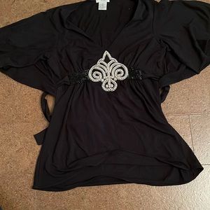 Black top with tie in the back with rhinestones